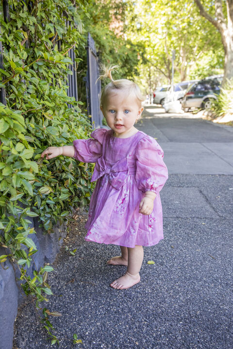 baby matilda mini bow dress in pink flora in colour PEACH WHIP