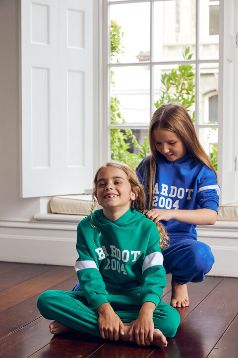 GIRLS OVERSIZED ADVENTURE HOODIE in colour DEEP GRASS GREEN