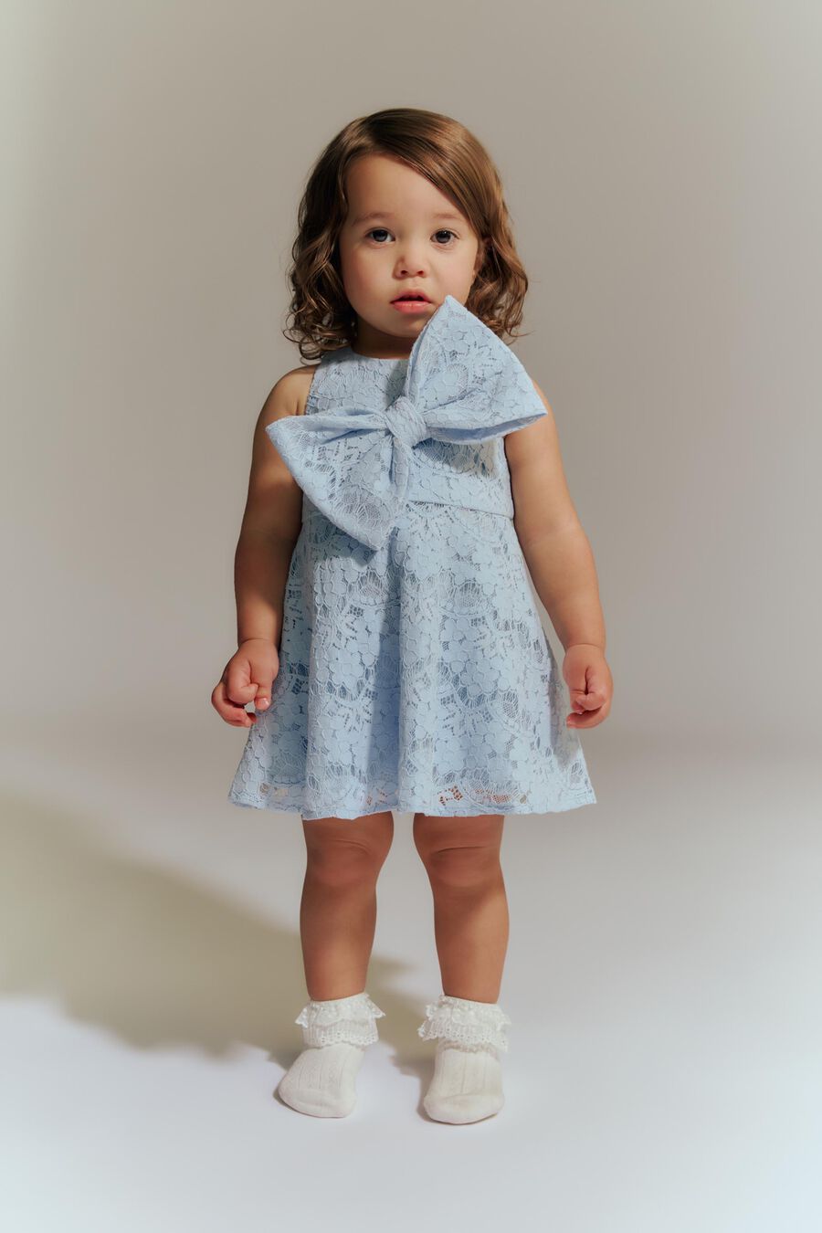 SUKI MINI BOW DRESS in colour Powder Blue