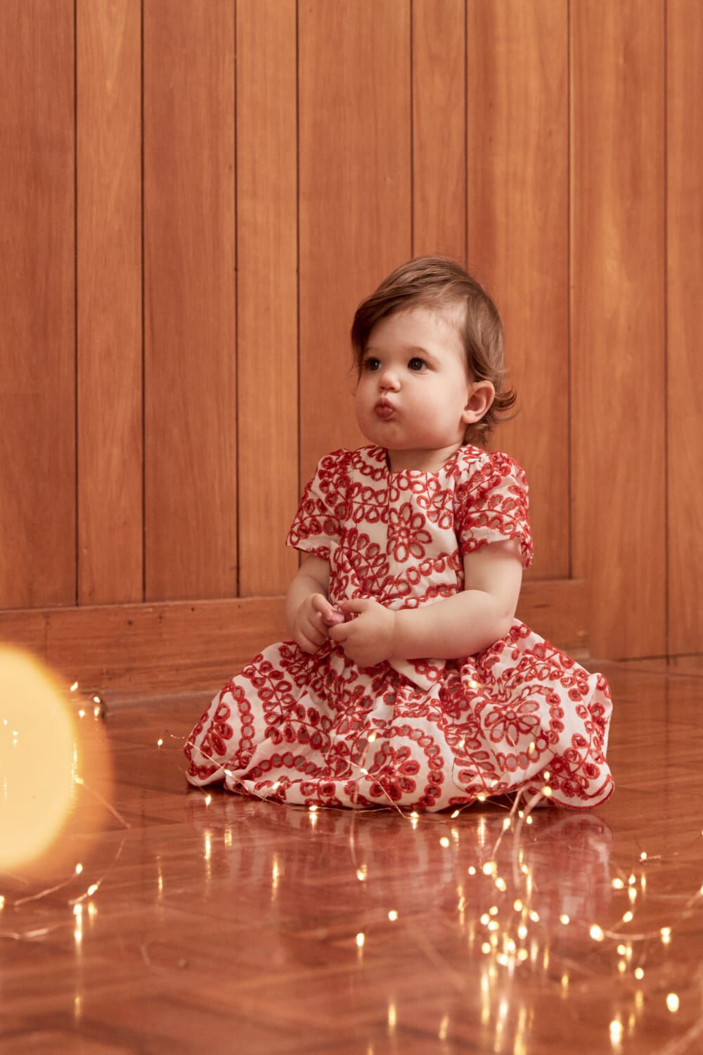 BABY GIRL NIKITA BRODERIE DRESS in colour POINSETTIA