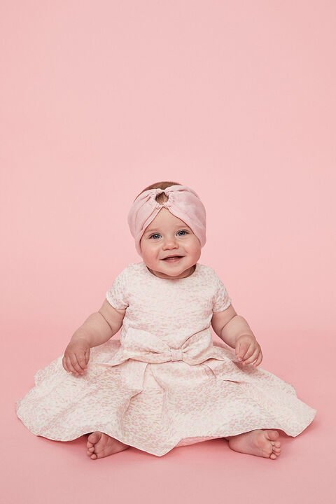 BABY GIRL MIRELA MINI BOW DRESS in colour APRICOT ICE