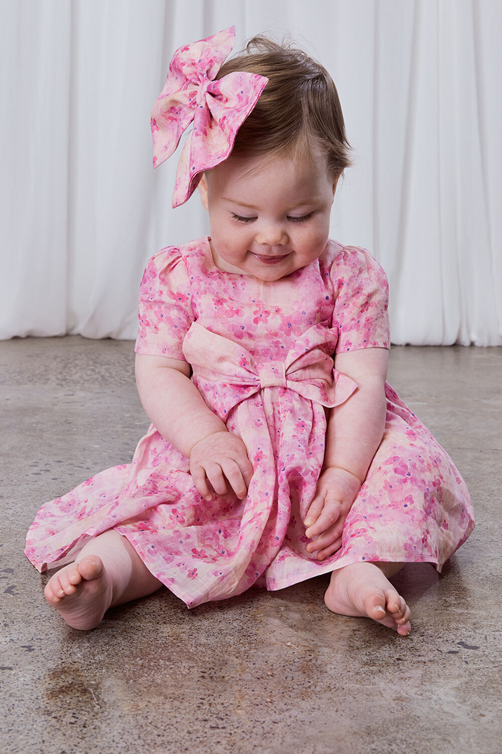 BABY GIRL JASMINE MINI DRESS in colour PEACH WHIP
