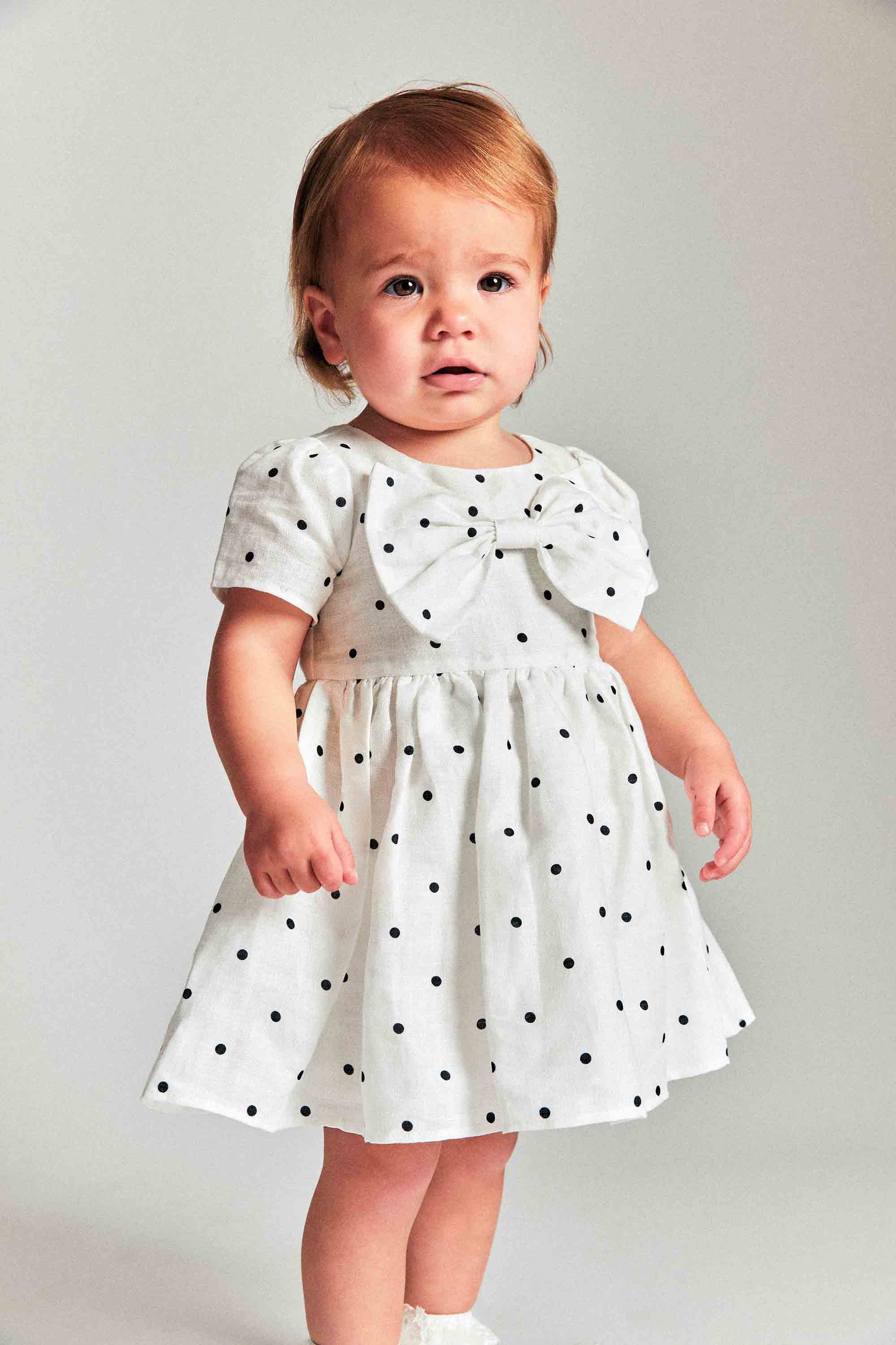 Bardot Junior Baby Girl Alice Bow Dress In White Spot
